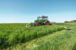 Fendt 300 tractor cutting grass