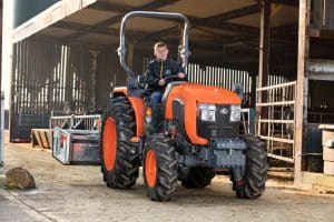Kubota L1 Series compact tractor on a farm