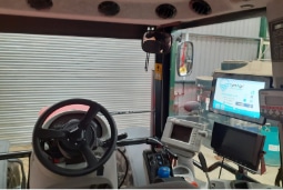Inside a machines cab behind the wheel