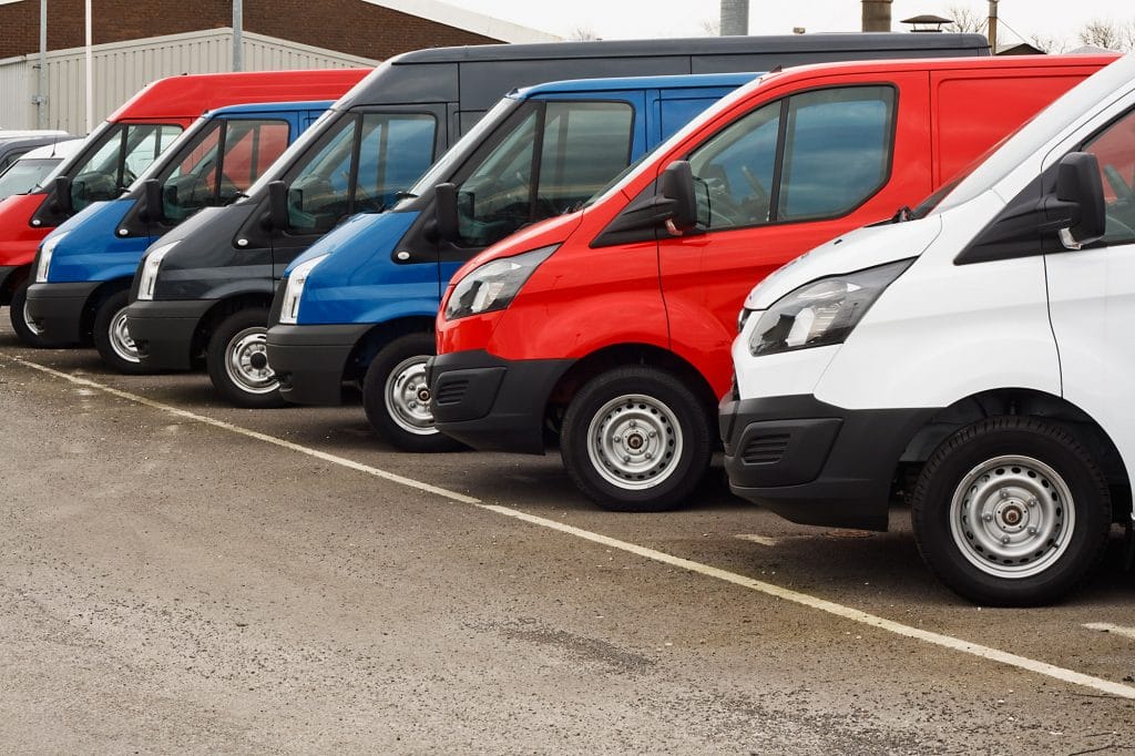 Row of used vans in a car pack