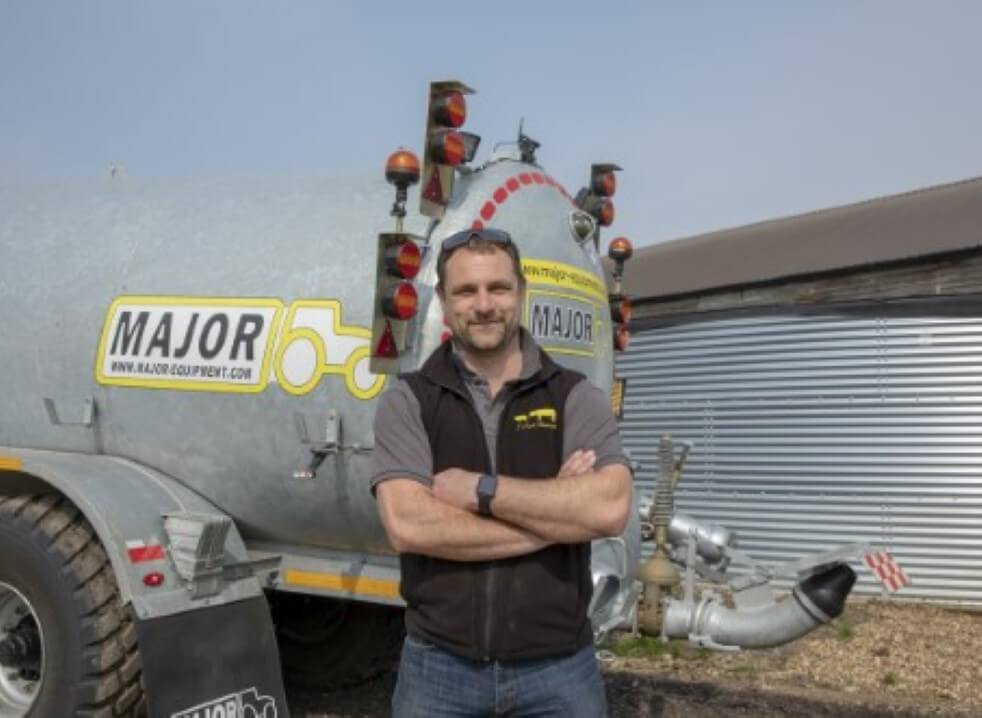 John Nurse in front of major 4000 gallon tandem axle tanker