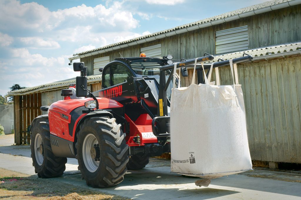 Manitou telehandler carrying a bulk bag of loose goods