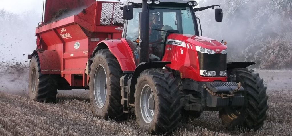 Massey Ferguson tractor spreading fertilizer