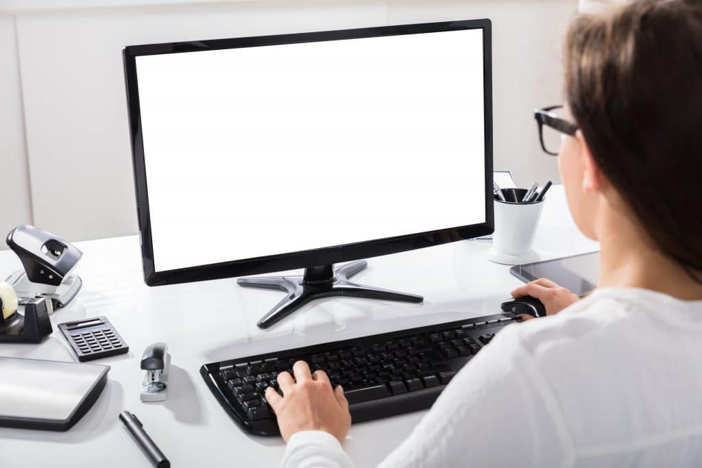 Person looking at a white computer screen