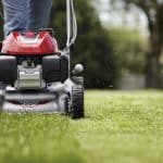 Honda Izy HRG466 PK mower in action cutting a green lawn