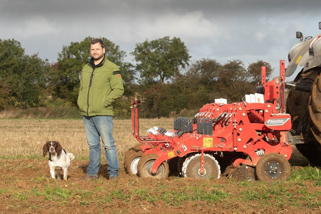 Jack Robinson farmer standing next to Kverneland kultistrip