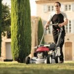 Man using a Honda Hrd536 Hx 53Cm Professional Variable Speed Lawnmower