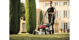 Man using a Honda Hrd536 Hx 53Cm Professional Variable Speed Lawnmower