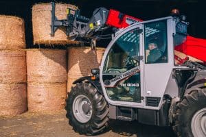 Massey Ferguson telehandler lifting bales