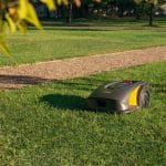 Robotic STIGA A 5000 mower maintaining a landscaped estate lawn