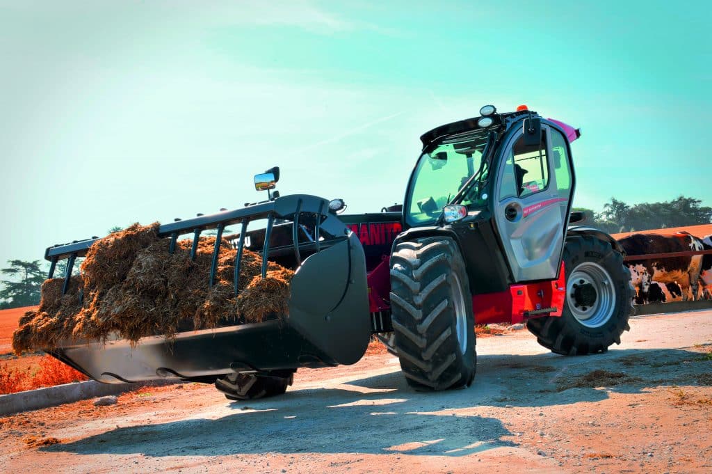 Manitou agricultural telehandler with grab bucket