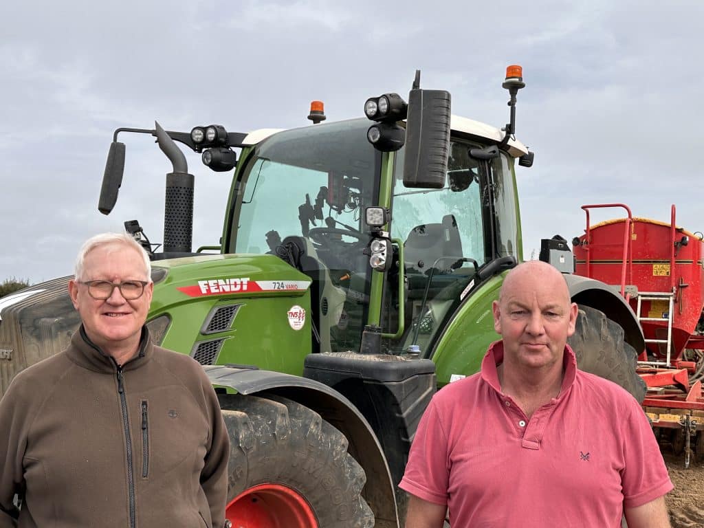 Farmer Michael Paul (left) is pictured with tractor operator John Tooley