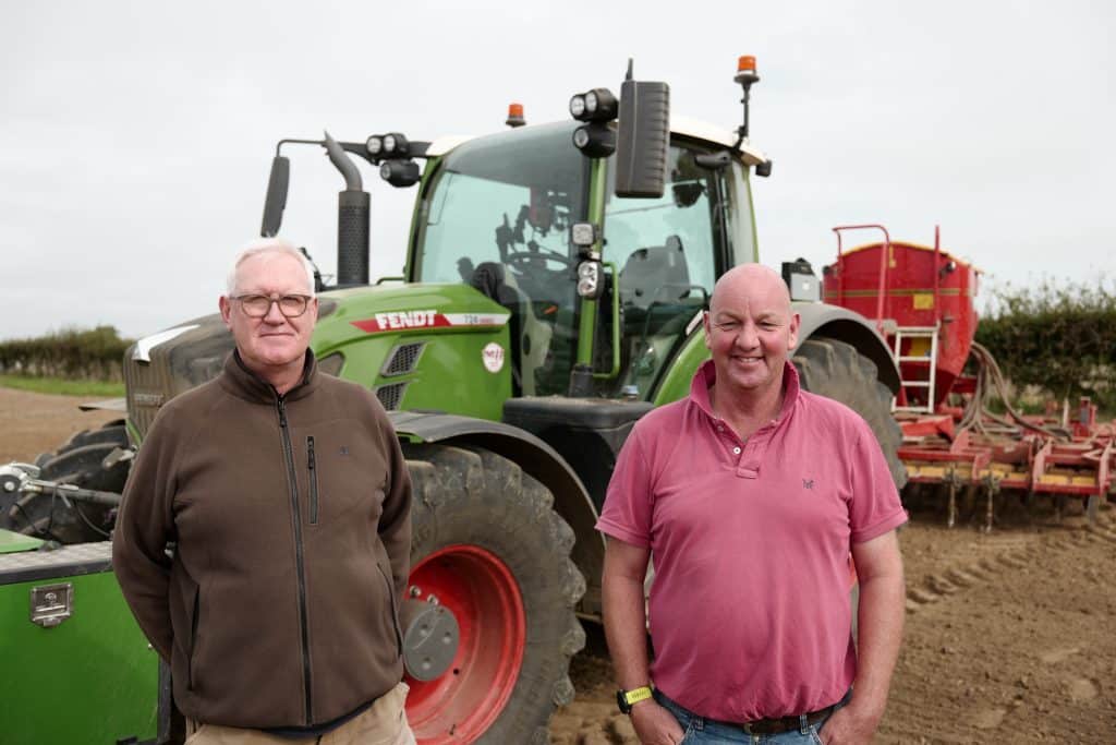 Farmer Michael Paul (left) is pictured with tractor operator John Tooley