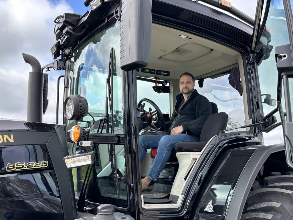 Farmer John Nurse in his bespoke Massey Ferguson 8S.255 tractor