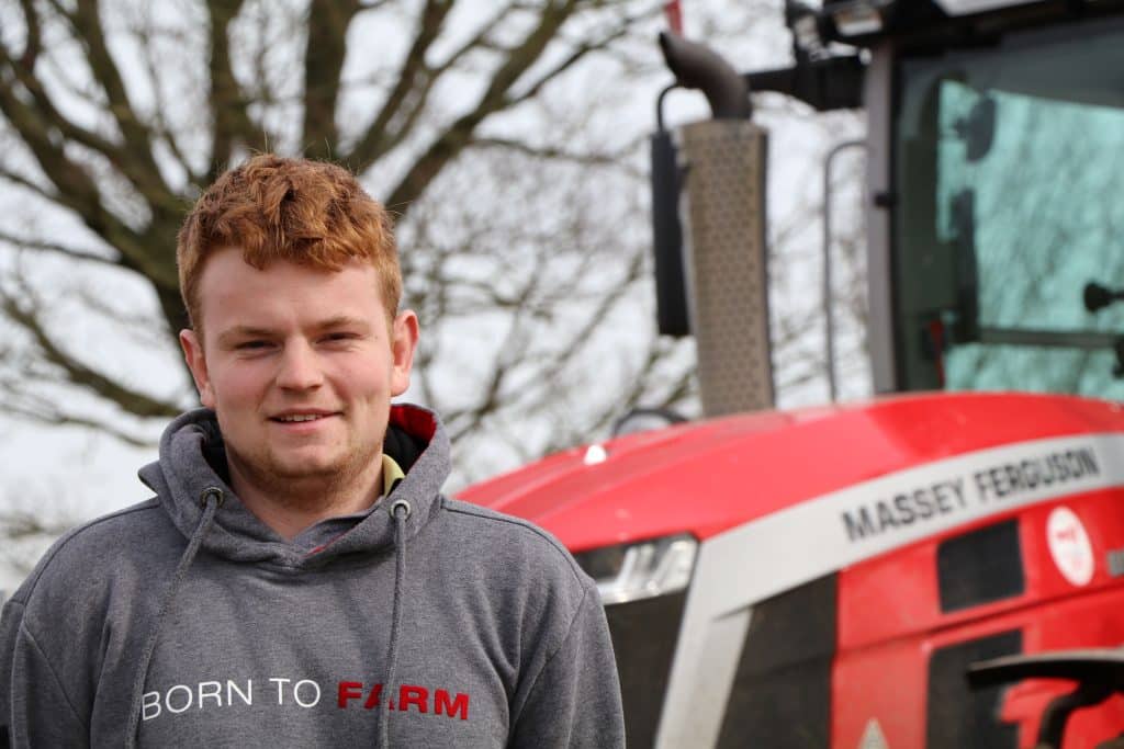 Norfolk farmer Will Basey-Fisher with his Massey Ferguson 8S tractor
