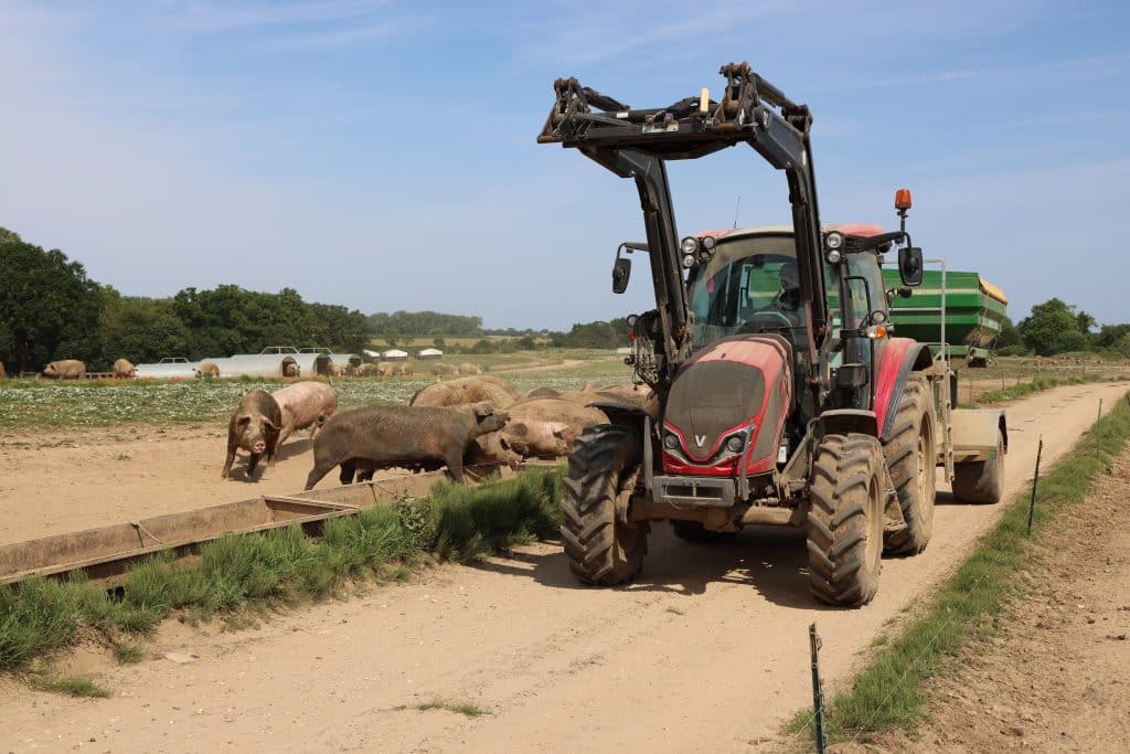 The Valtra A115 operating the trailed pneumatic feeder